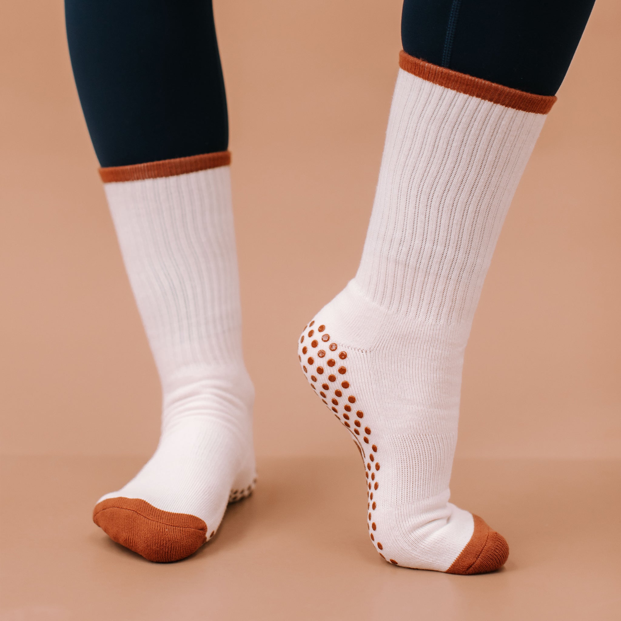 White Crew Grip Socks with Orange Trim - On Model | Your Reformer