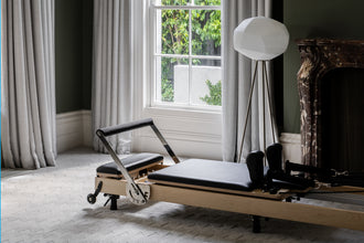 Maple Wood Foldable Reformer - Classic Home Interior Setup | Your Reformer