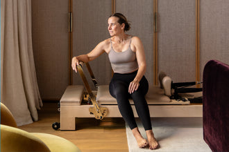 Studio Pilates Reformer - Seated Exercise Position | Your Reformer